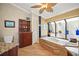 Elegant bathroom with garden tub, tile floors, and decorative ceiling fan at 852 3Rd Ave S, Tierra Verde, FL 33715