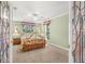 Charming bedroom with a brass bed frame, neutral walls, plush carpet, and stained-glass windows at 852 3Rd Ave S, Tierra Verde, FL 33715