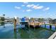 A personal boat lift ensures safe and convenient storage, visible from the tranquil canal at 852 3Rd Ave S, Tierra Verde, FL 33715