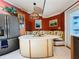 Charming breakfast nook with a built-in bench, adjacent to the kitchen and featuring custom stained-glass lighting at 852 3Rd Ave S, Tierra Verde, FL 33715