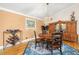 Traditional dining room featuring a round wood table, unique rug, and a built-in hutch at 852 3Rd Ave S, Tierra Verde, FL 33715