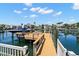 Picturesque dock with boat lift provides easy access to the water and stunning waterfront views at 852 3Rd Ave S, Tierra Verde, FL 33715