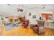 Open living space with hardwood floors, a vaulted ceiling, and comfortable seating, perfect for relaxing or entertaining at 852 3Rd Ave S, Tierra Verde, FL 33715