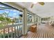 Screened-in porch with views of pool and waterfront at 852 3Rd Ave S, Tierra Verde, FL 33715