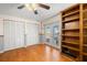 Room with hardwood floors, ceiling fan, and large closet space at 852 3Rd Ave S, Tierra Verde, FL 33715