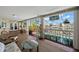Spacious screened patio offers serene waterfront views with outdoor seating overlooking the pool and canal at 852 3Rd Ave S, Tierra Verde, FL 33715