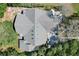 Detailed aerial view showing a well-maintained roof with multiple skylights and surrounding foliage at 4318 River Birch Dr, Spring Hill, FL 34607