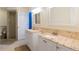 Bathroom featuring granite top vanities and a door to a shower at 4318 River Birch Dr, Spring Hill, FL 34607