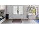 Bright entrance featuring double doors with decorative glass, a side window, and storage space at 4318 River Birch Dr, Spring Hill, FL 34607