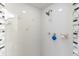 Tiled shower featuring updated shower head and glass tile accents at 4318 River Birch Dr, Spring Hill, FL 34607
