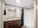 Clean bathroom featuring granite countertops and a shower-tub combination at 6008 Angus Valley Dr, Wesley Chapel, FL 33544