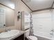Bright bathroom featuring a shower-tub combo, granite vanity, and modern fixtures at 6008 Angus Valley Dr, Wesley Chapel, FL 33544