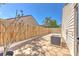 Private backyard featuring a paver patio, new AC, and well-maintained fence for outdoor enjoyment at 7102 Silvermill Dr, Tampa, FL 33635