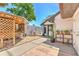 Charming backyard patio area with room for seating, potted plants, and a trellis at 7102 Silvermill Dr, Tampa, FL 33635