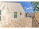 Paver patio and fenced yard offer a relaxing outdoor space with mature landscaping at 7102 Silvermill Dr, Tampa, FL 33635