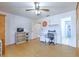 Spacious bedroom with wood floors and an adjacent bathroom; good for home office or den at 7102 Silvermill Dr, Tampa, FL 33635
