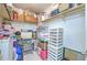 Walk-in closet with shelving, packed with storage bins and boxes at 7102 Silvermill Dr, Tampa, FL 33635