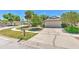 Charming home featuring a two-car garage and lush landscaping at 7102 Silvermill Dr, Tampa, FL 33635