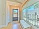 Bright foyer with wood floors and large window overlooking the courtyard at 7102 Silvermill Dr, Tampa, FL 33635