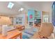 Spacious living room boasting skylights, a fireplace, and access to the sunroom at 7102 Silvermill Dr, Tampa, FL 33635