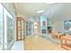 Spacious living room with wood floors, fireplace, and sliding glass doors at 7102 Silvermill Dr, Tampa, FL 33635