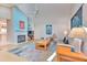 Open living room with fireplace, ceiling fan, and stylish decor elements at 7102 Silvermill Dr, Tampa, FL 33635