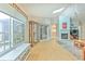 Spacious living room with wood floors, fireplace, and sliding glass doors at 7102 Silvermill Dr, Tampa, FL 33635