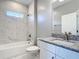 Bathroom showcasing marble tile, granite countertop and a shower-tub combo at 1696 Bendix Ter, North Port, FL 34286
