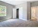 Neutral bedroom featuring plush carpet, a closet, and bright natural light at 1696 Bendix Ter, North Port, FL 34286