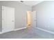 Neutral bedroom featuring plush carpet and white doors leading to other rooms at 1696 Bendix Ter, North Port, FL 34286