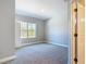 Neutral bedroom featuring plush carpet and a window with natural light at 1696 Bendix Ter, North Port, FL 34286