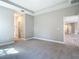 Spacious main bedroom featuring plush carpeting and recessed lighting at 1696 Bendix Ter, North Port, FL 34286