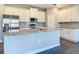 Modern kitchen featuring stainless steel appliances, granite countertops, and white cabinets at 2223 Hattie Ct, North Port, FL 34288