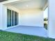 Covered outdoor patio with sliding glass doors offers a seamless transition to the home's interior at 2223 Hattie Ct, North Port, FL 34288