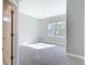 Bedroom featuring neutral tones, carpet flooring, and a window at 2423 Sadnet Ln, North Port, FL 34286