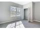 Bedroom featuring neutral tones, carpet flooring, a window, and an open closet at 2423 Sadnet Ln, North Port, FL 34286