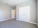 Bedroom featuring neutral tones, carpet flooring, and a double-door closet at 2423 Sadnet Ln, North Port, FL 34286