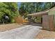 Spacious backyard with a covered carport, offering plenty of room for outdoor activities and parking at 107 W Woodlawn Ave, Tampa, FL 33603