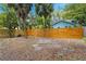 A well-maintained wooden fence surrounds the property, offering privacy and security to the backyard at 107 W Woodlawn Ave, Tampa, FL 33603
