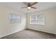 The primary bedroom has natural light, ceiling fan, and neutral walls, creating a calming retreat at 107 W Woodlawn Ave, Tampa, FL 33603