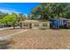 Charming single-story home with a well-maintained lawn and mature trees in a peaceful neighborhood at 107 W Woodlawn Ave, Tampa, FL 33603