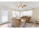 Cozy living room with lots of windows for natural light, offering an inviting atmosphere at 107 W Woodlawn Ave, Tampa, FL 33603
