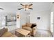Open living area with neutral tones, flowing into a bright kitchen with white cabinetry at 107 W Woodlawn Ave, Tampa, FL 33603