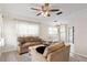 Bright living room with comfortable seating, hardwood floors, and a ceiling fan for relaxed living at 107 W Woodlawn Ave, Tampa, FL 33603