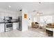 Open-concept floor plan with kitchen flowing into the living area with neutral tones and ample natural light at 107 W Woodlawn Ave, Tampa, FL 33603