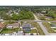 Aerial view of a home with a screened pool enclosure and a white fence at 5188 Elwood Rd, Spring Hill, FL 34608