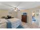 Bedroom with natural light, tiled floors, desk, and neutral color palette at 5188 Elwood Rd, Spring Hill, FL 34608