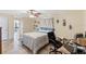 Bedroom with blue decor, tiled floors, and office space at 5188 Elwood Rd, Spring Hill, FL 34608