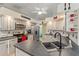 Updated kitchen with stainless steel appliances, countertop, and decorative accents at 5188 Elwood Rd, Spring Hill, FL 34608