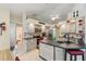 Modern kitchen showcasing gray cabinets, stainless steel appliances, and an adjacent dining area at 5188 Elwood Rd, Spring Hill, FL 34608